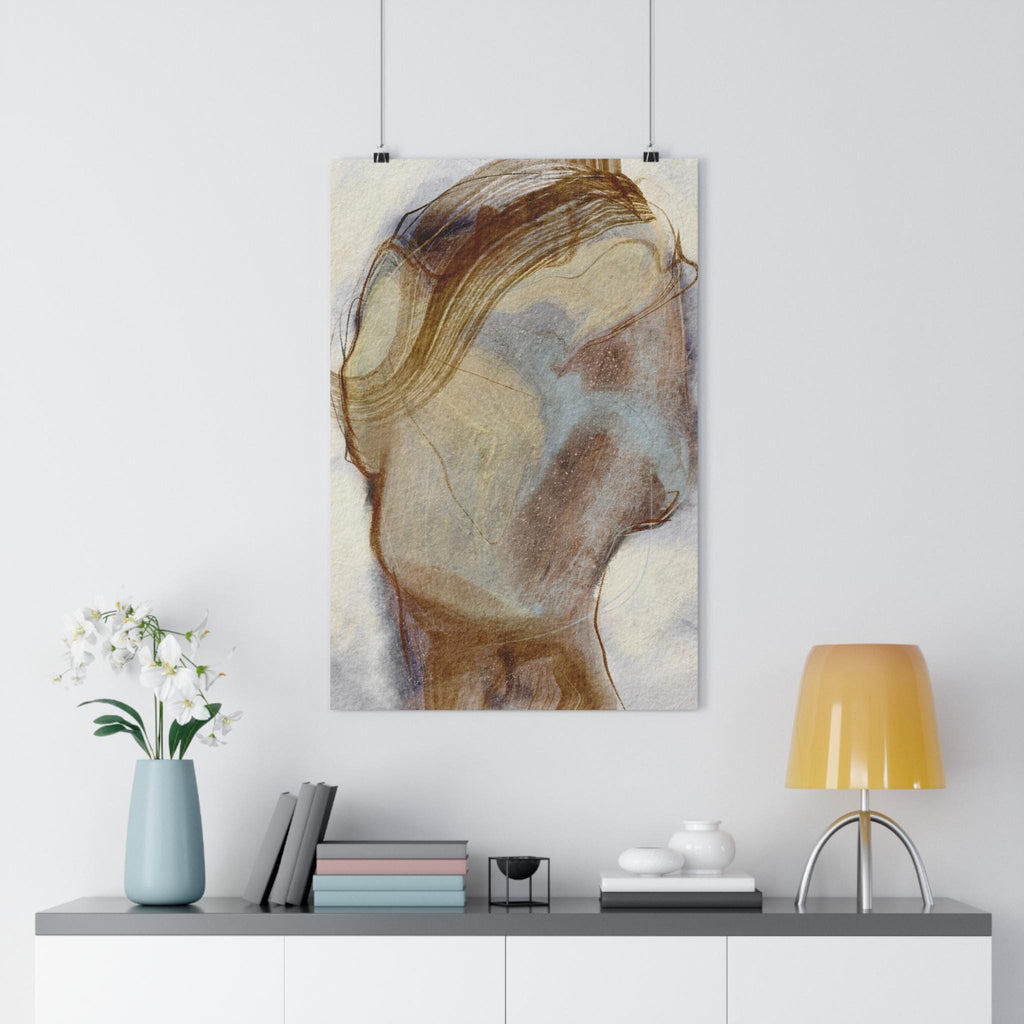 Abstract art print on a wall above a white cabinet with decor items.